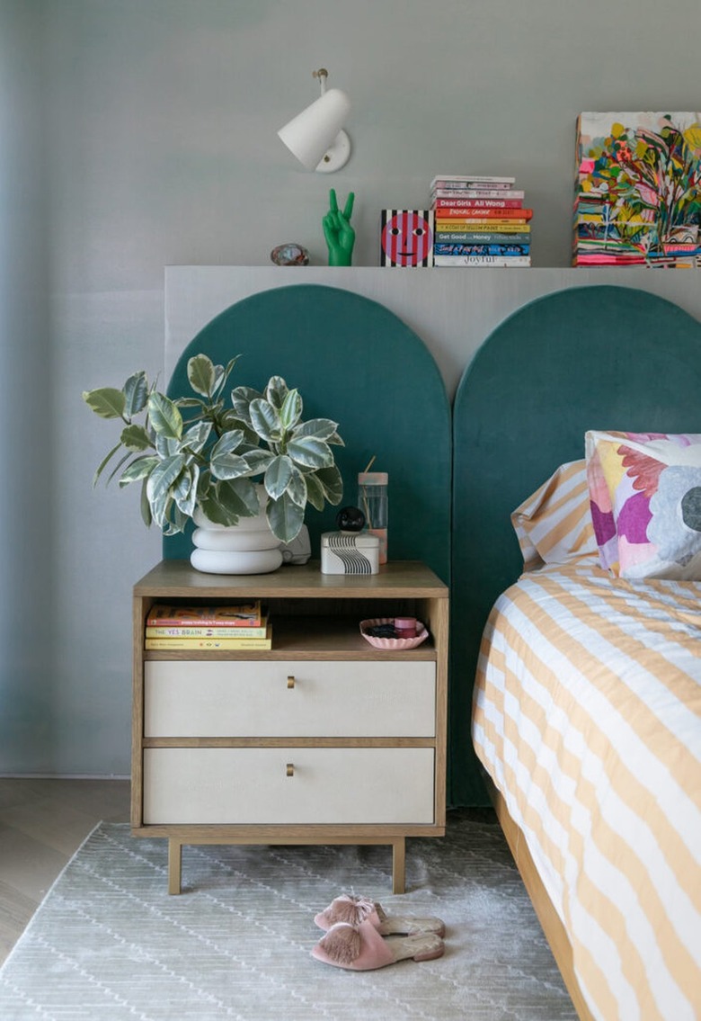 gray bedroom walls with teal headboard