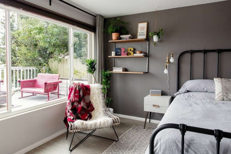 gray bedroom walls with black bed frame