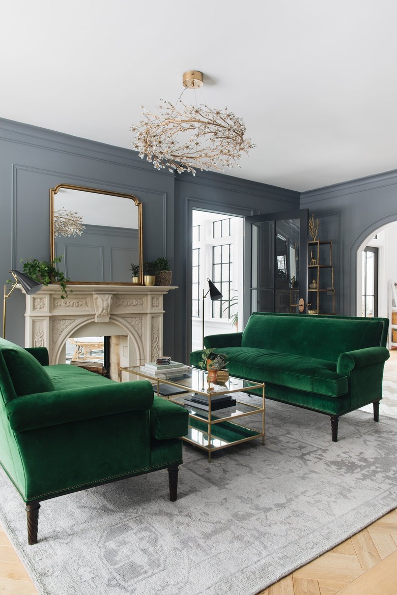 emerald green sofas in green den