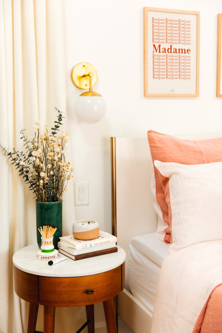 bedroom with ivory walls and bush and ivory bedding
