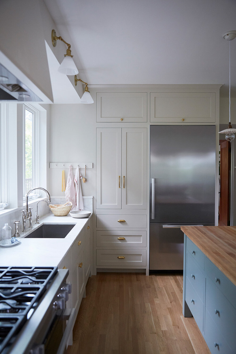 kitchen with ivory cabinets and cornflower blue island