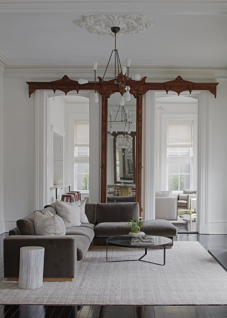 living room with gray sofa and greige area rug