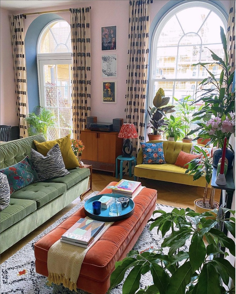 Eclectic living room with green sofa