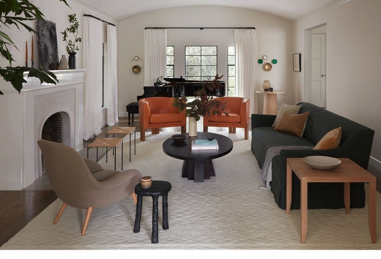 living room with orange chairs