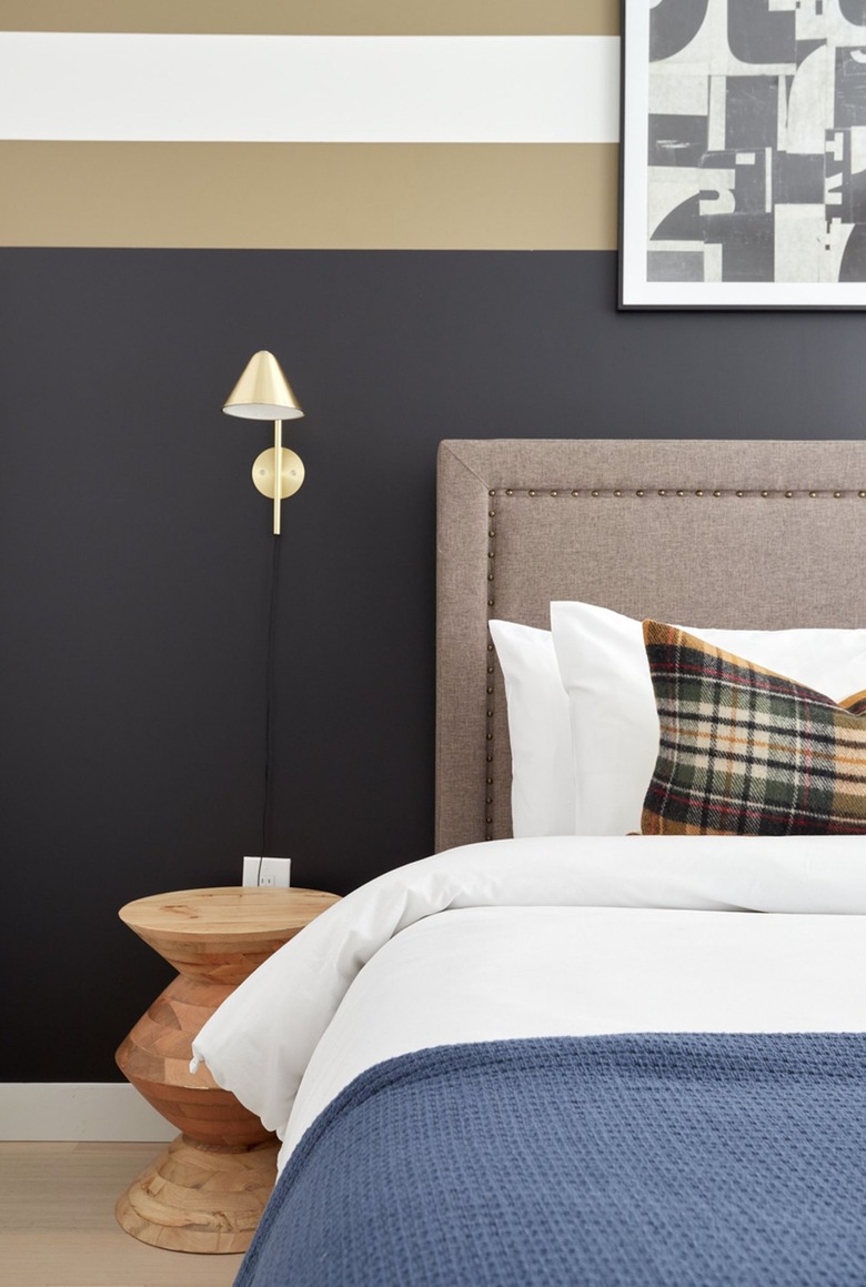 bedroom with black and tan walls