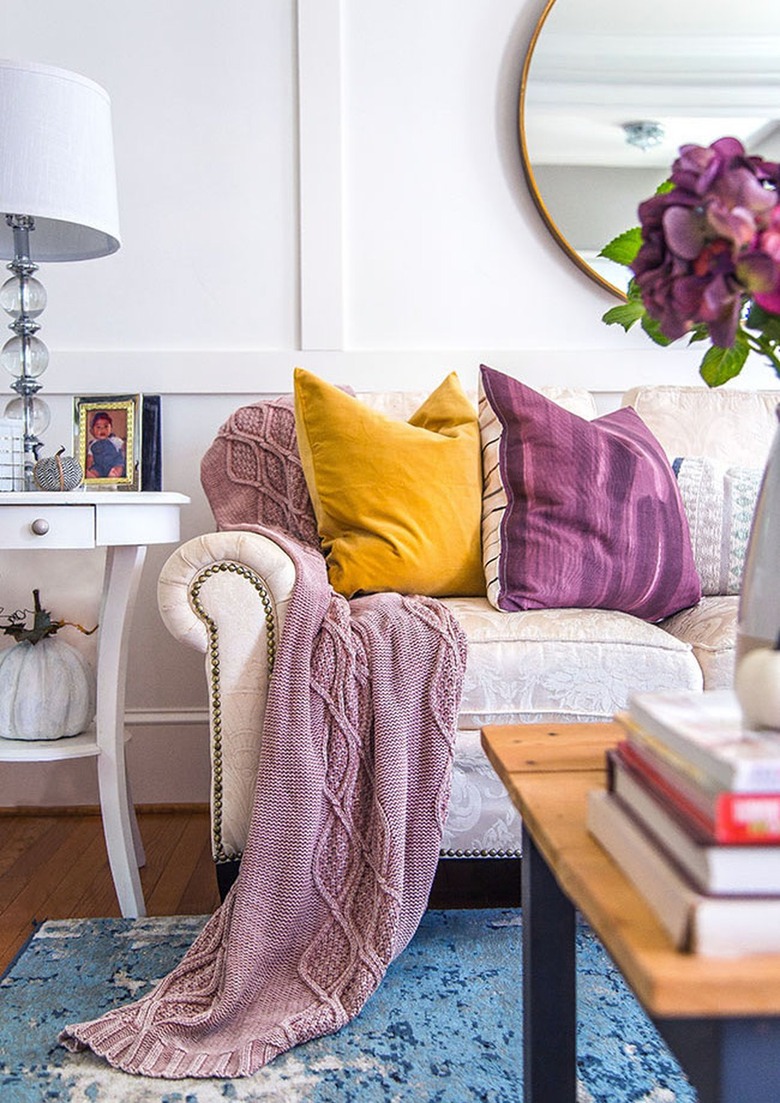 Living room with white couch and walls