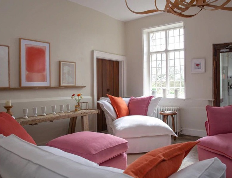 taupe living room with pink accents