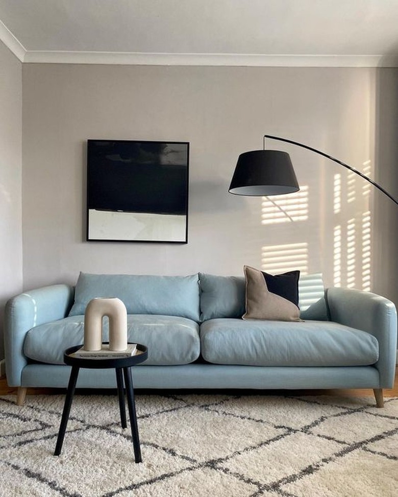 taupe living room with light blue sofa