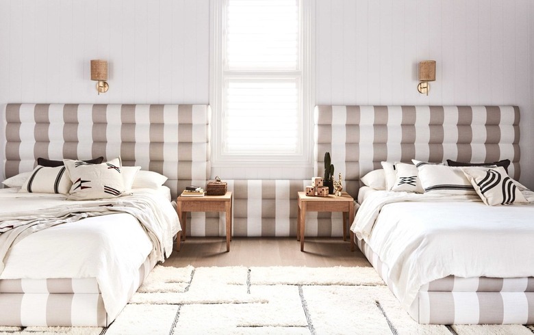 Bedroom with taupe patterned headboards