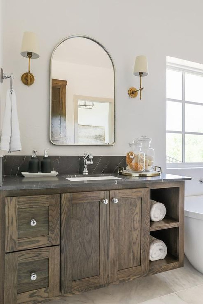 bathroom with rustic wood vanity and silver accents