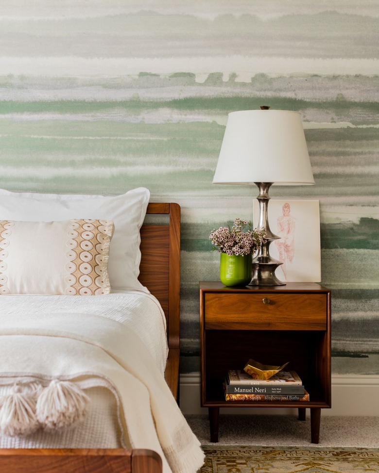 bedroom with green watercolor printed wallpaper