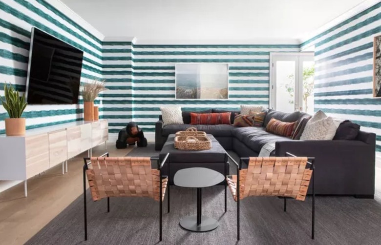 Living room with teal striped wallpaper