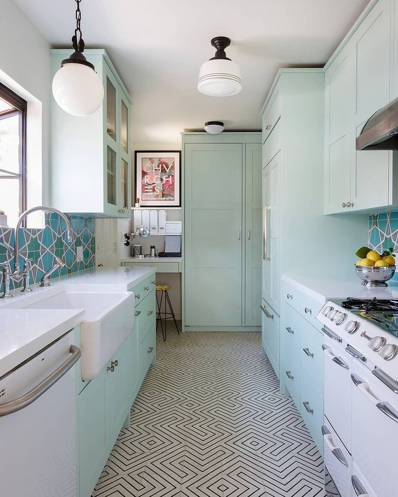 mint green kitchen with teal tile backsplash