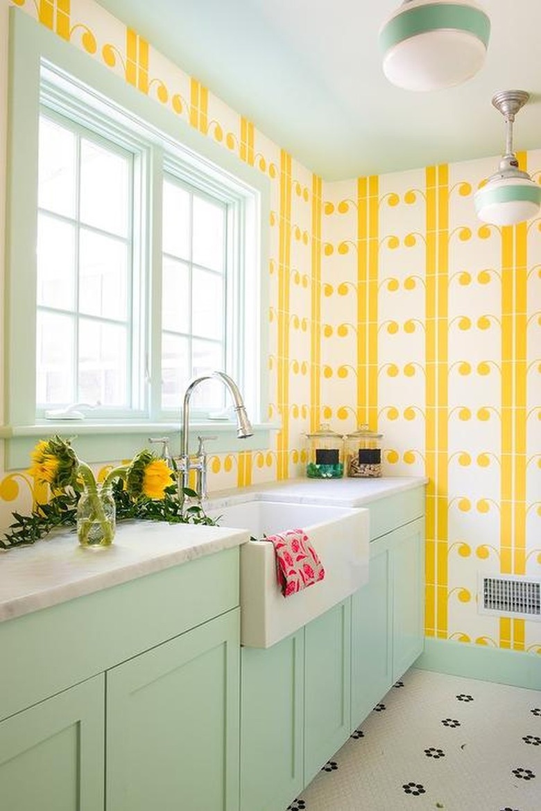 mint green and yellow laundry room