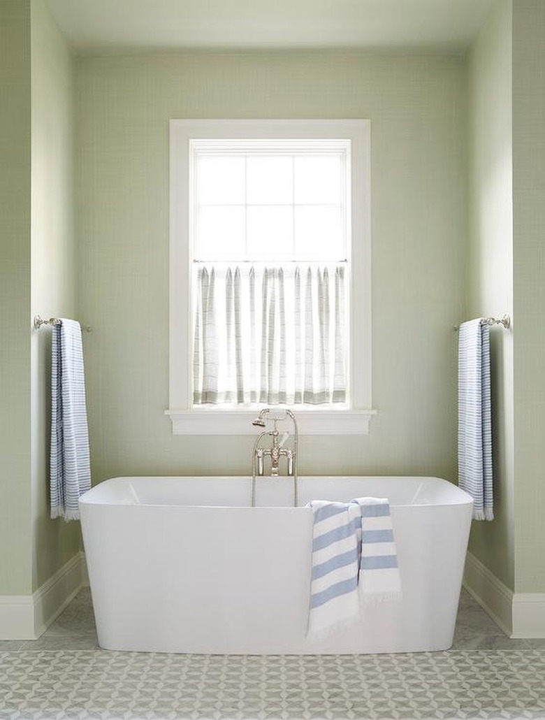 mint green bathroom with baby blue towels