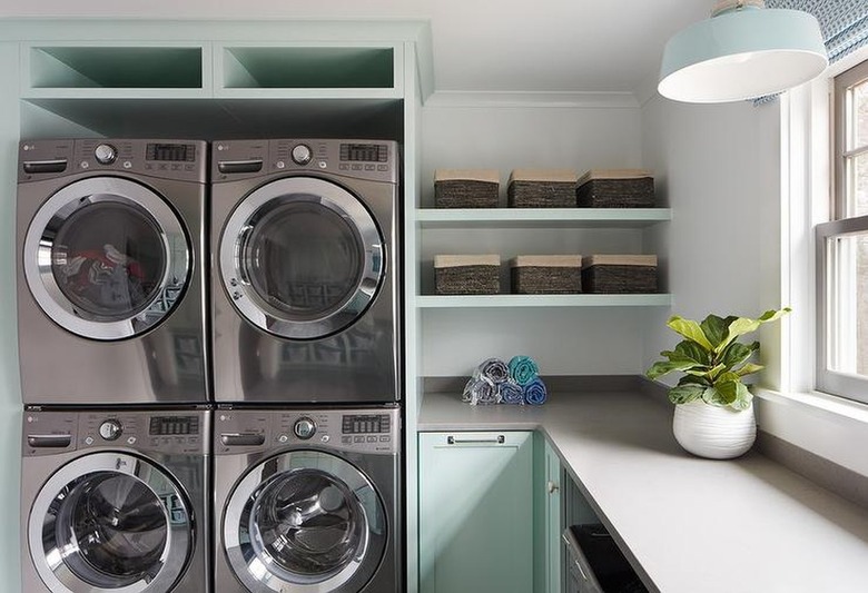 mint green laundry room with grey countertops
