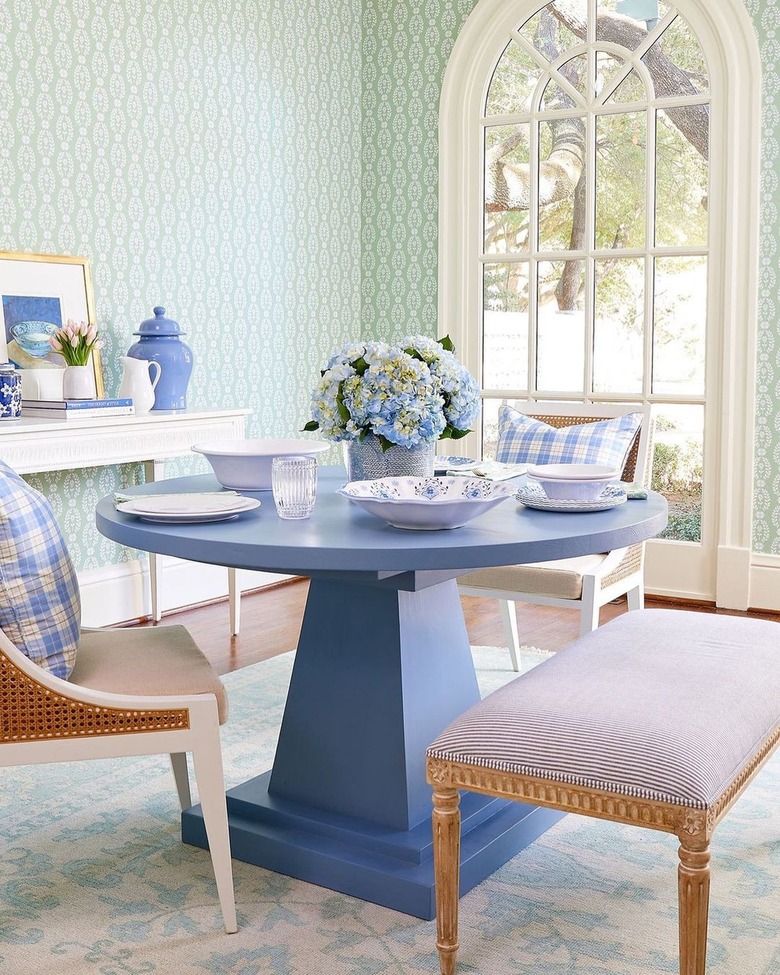 mint green dining room with periwinkle dining table