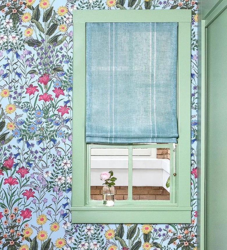 corner of room with blue floral wallpaper