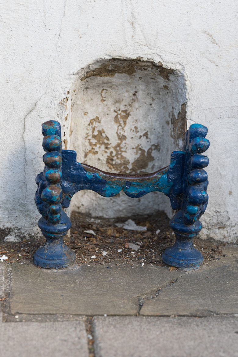 A blue tarnished boot scraper in a street of Oxford