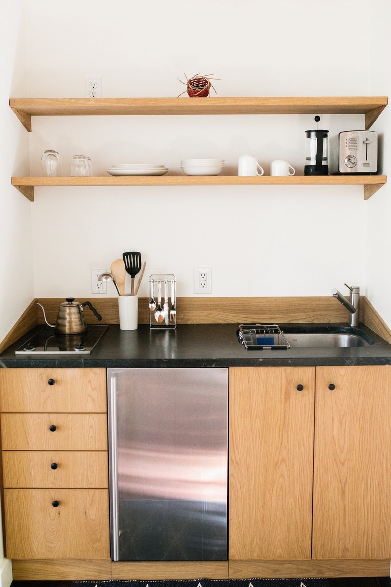kitchenette with light wood cabinets