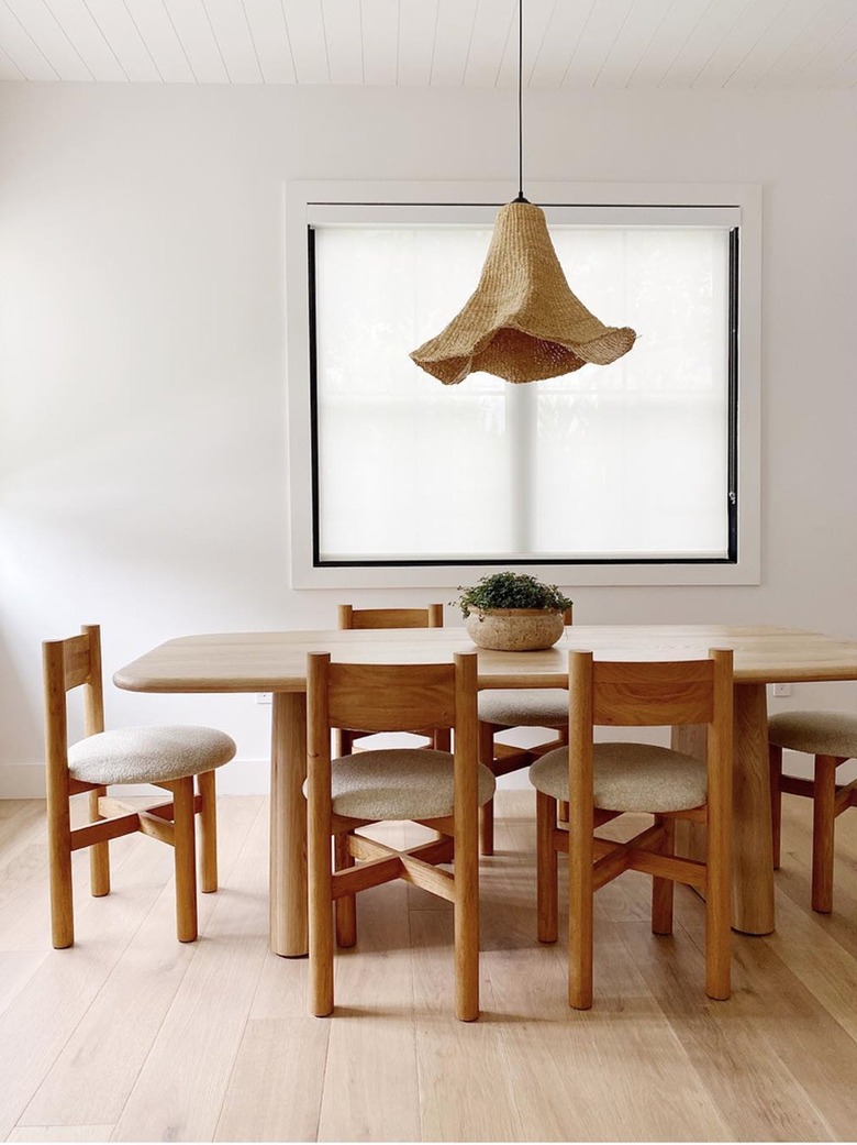 cali-boho dining room with boucle chairs