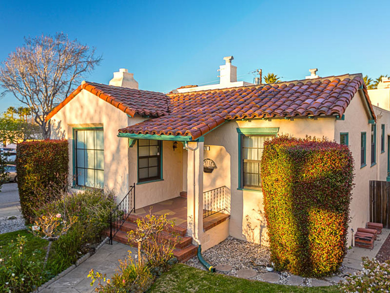 Small house with clay tile roof.