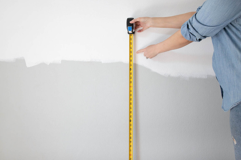 using tape measure on wall