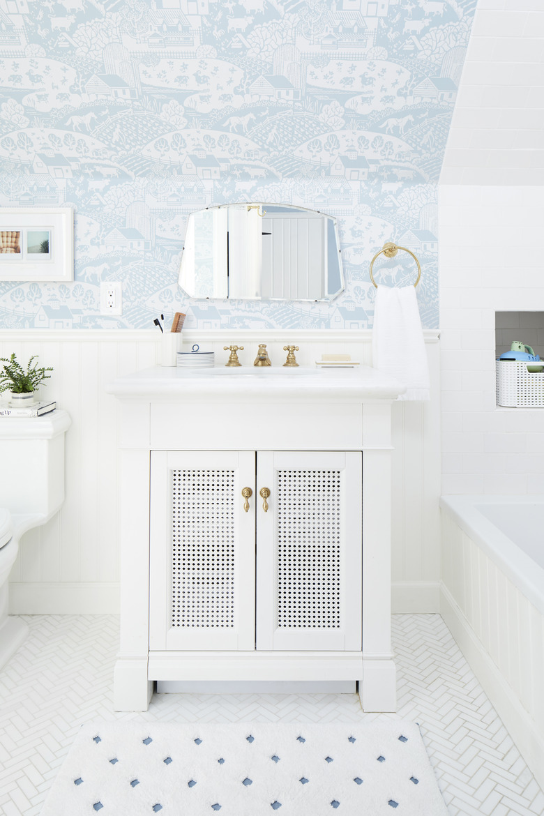 White bathroom with light blue wall paper