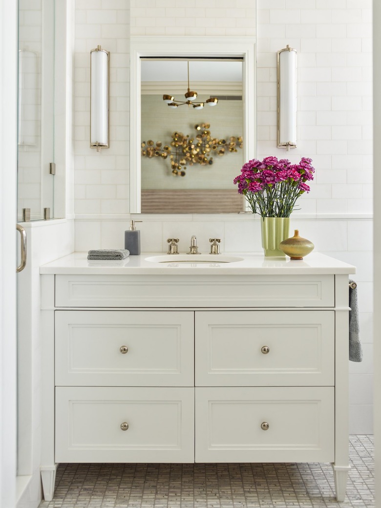 White bathroom with pink flowers