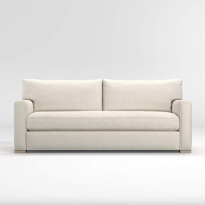 Crate and Barrel Axis bench sofa in white against a white backdrop