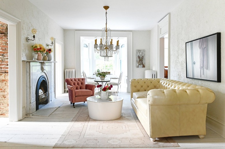 neutral living room with crystal chandelier