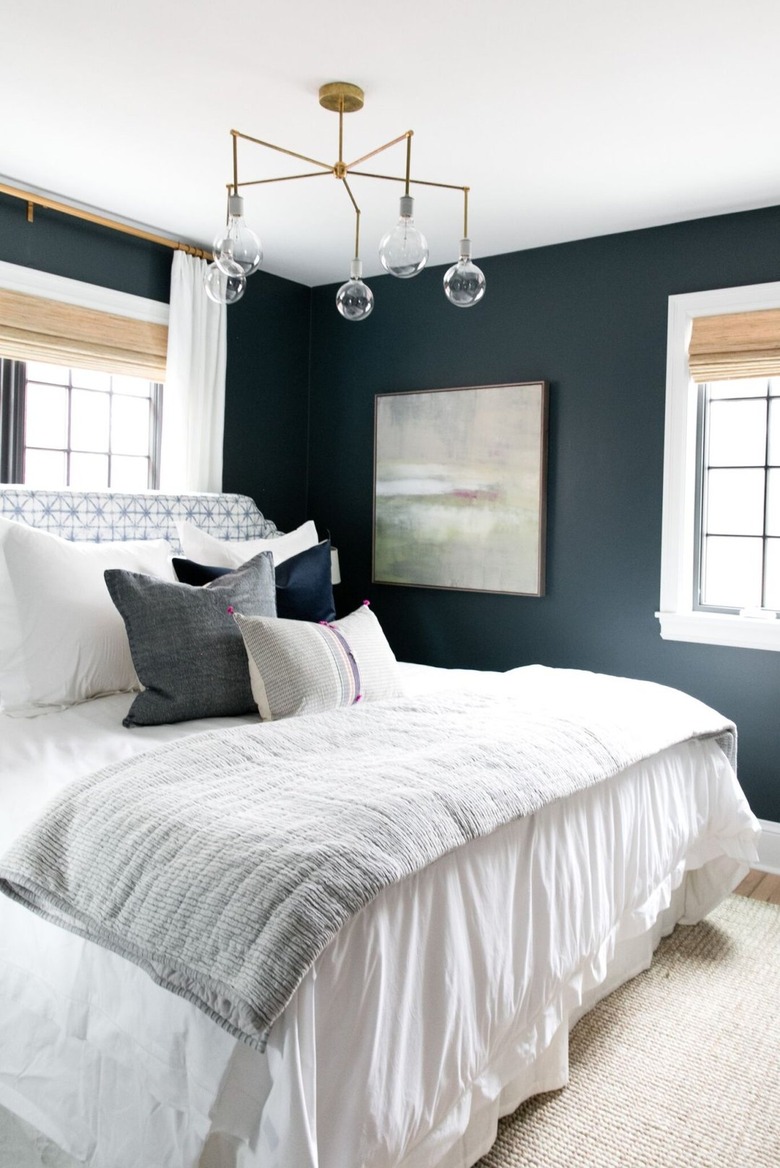 black bedroom with white window trim
