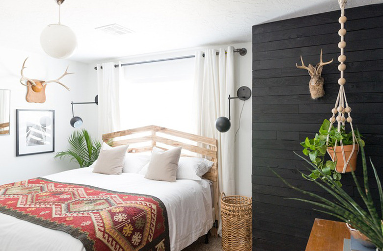 Scandinavian-inspired bedroom with black shiplap walls