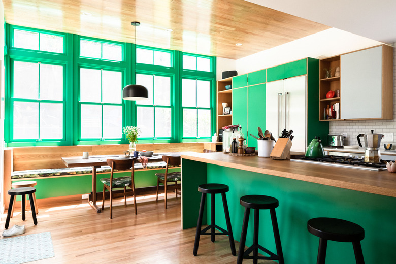 greenk itchen with wood countertops and bar