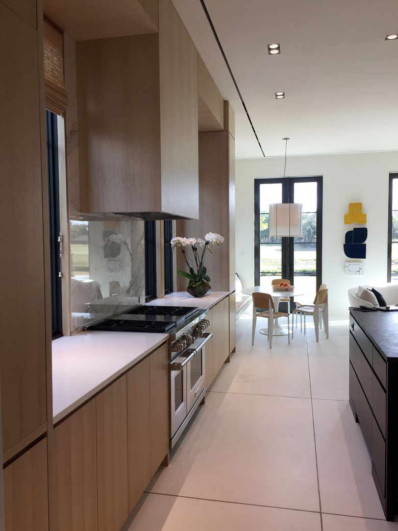 Wolf Stove in modern kitchen with wood cabinets