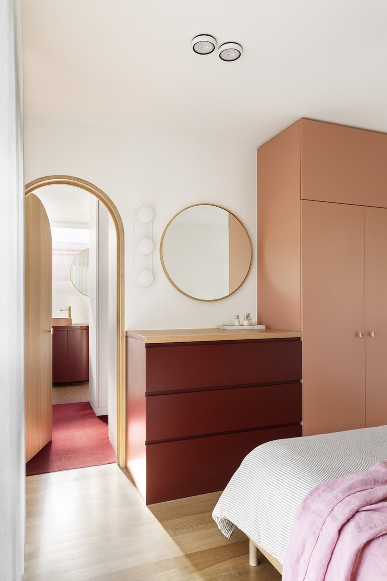 primary bedroom with colorful storage for clothing