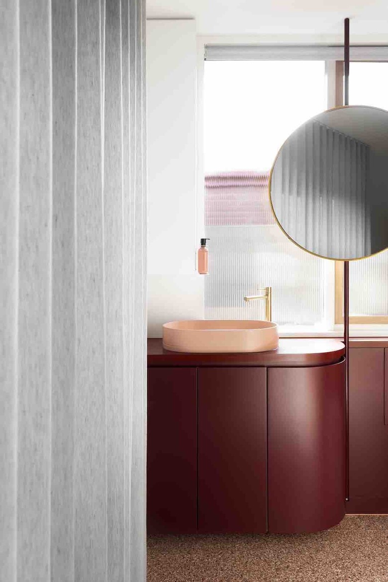 primary bathroom with pink and red palette