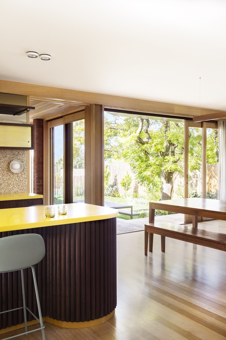 kitchen and dining area open to the backyard