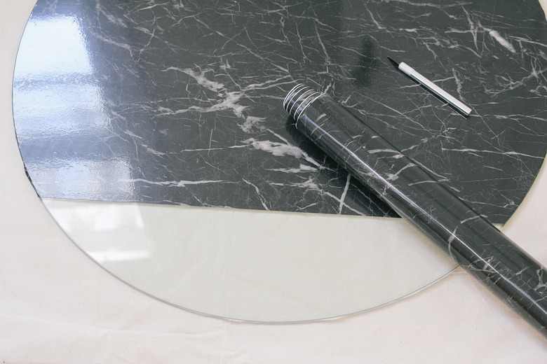 Coffee table partially covered with contact paper