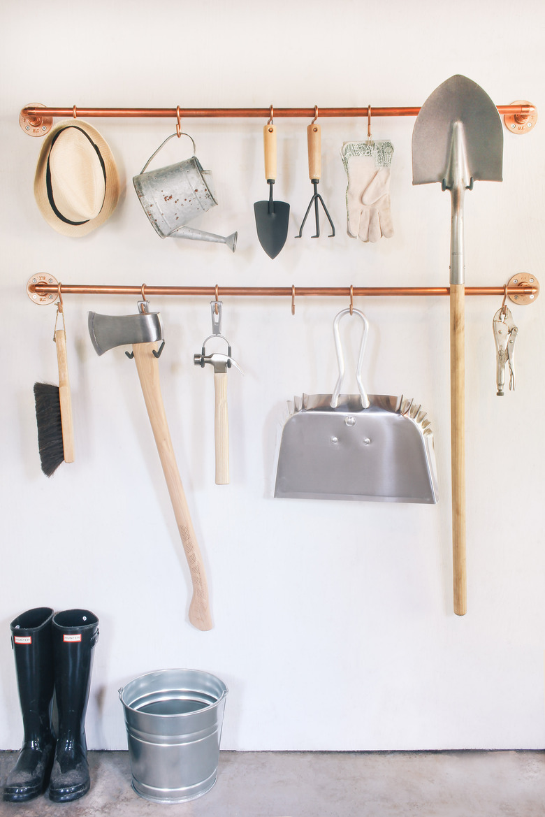 Copper pipe garage storage organization