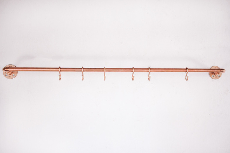 First copper pipe mounted on wall