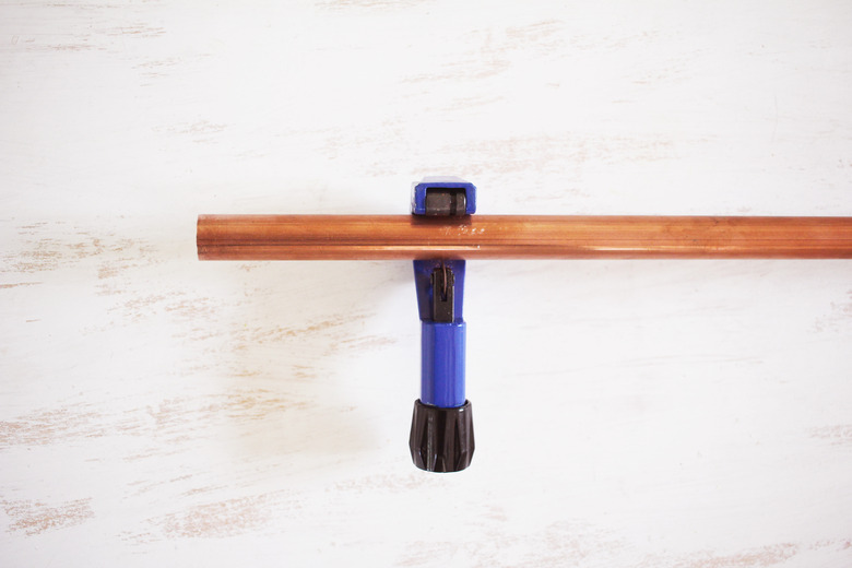 Cutting copper pipe with pipe cutter