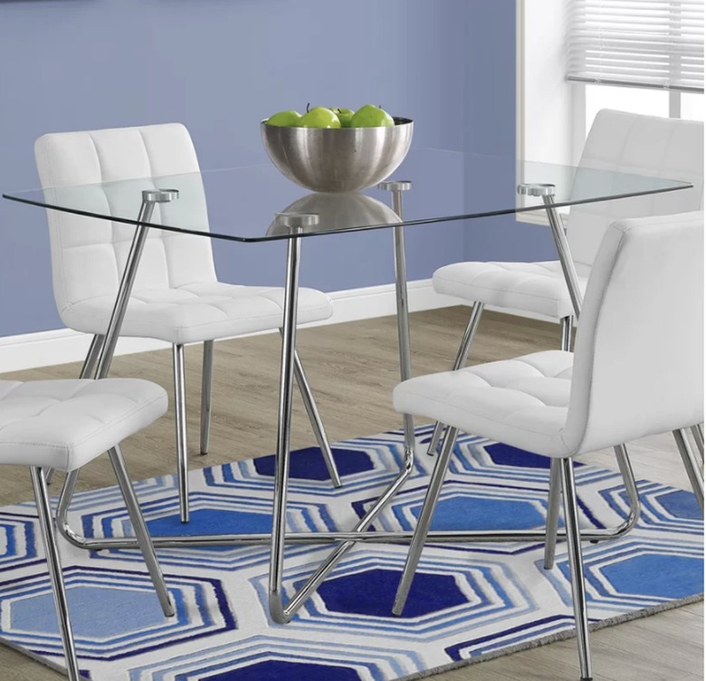 Glass top metal leg dining table