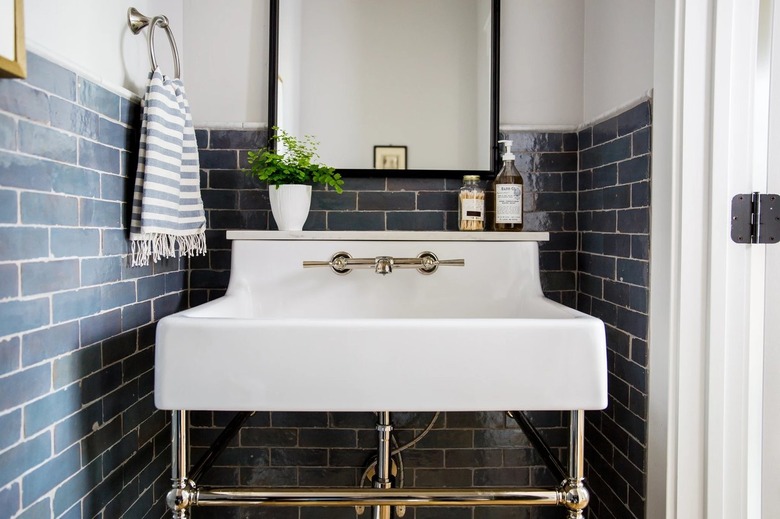 white powder room with blue zellige tiled walls