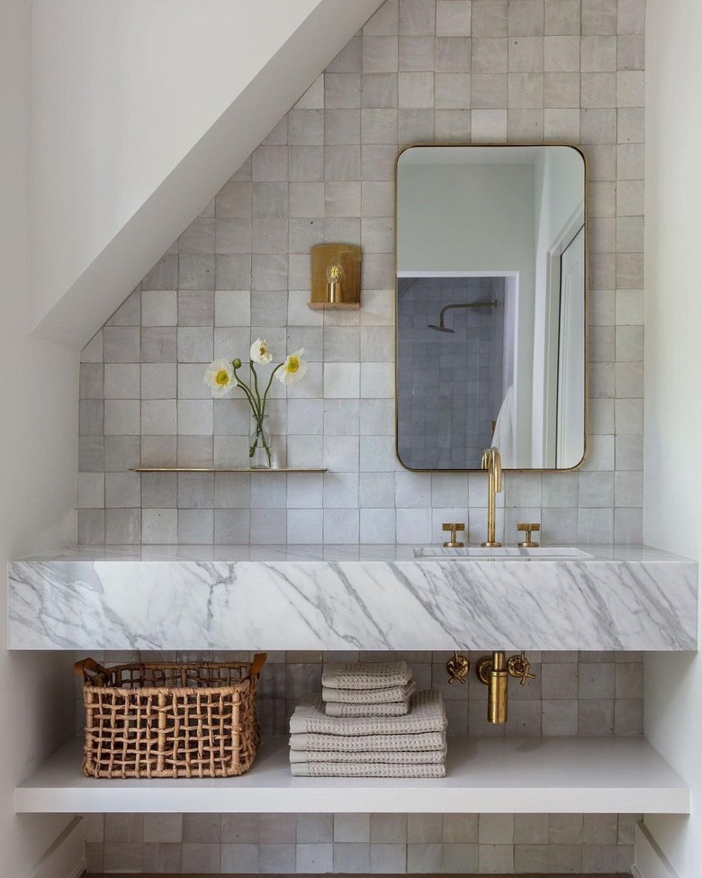 modern traditional bathroom with grayish white zellige tile backsplash