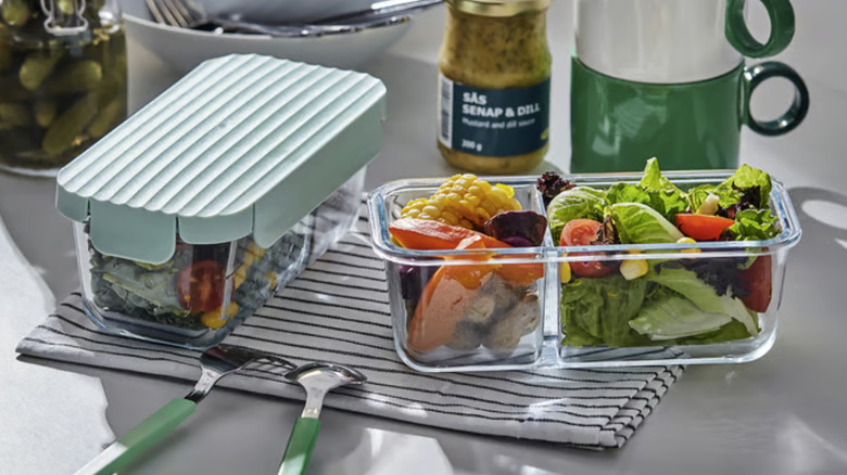 Divided food containers with meals in them