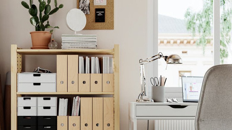 Birch magazine files are neatly organized on a bookshelf in a neutral home office