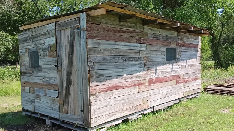 A large DIY shed made of pallet wood