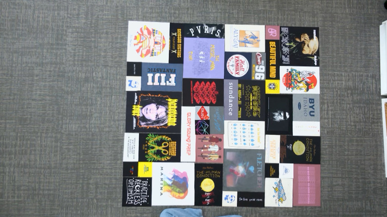 A large square quilt made of vintage band and movie shirts