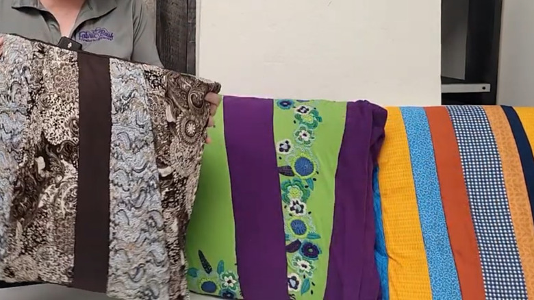 A trio of colorful pillows made from shirts